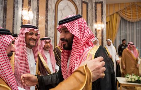 Saudi Arabia's Crown Prince Mohammed bin Salman (R) speaks with members of the royal family during an allegiance pledging ceremony in Mecca, Saudi Arabia June 21, 2017. Bandar Algaloud/Courtesy of Saudi Royal Court/Handout via REUTERS