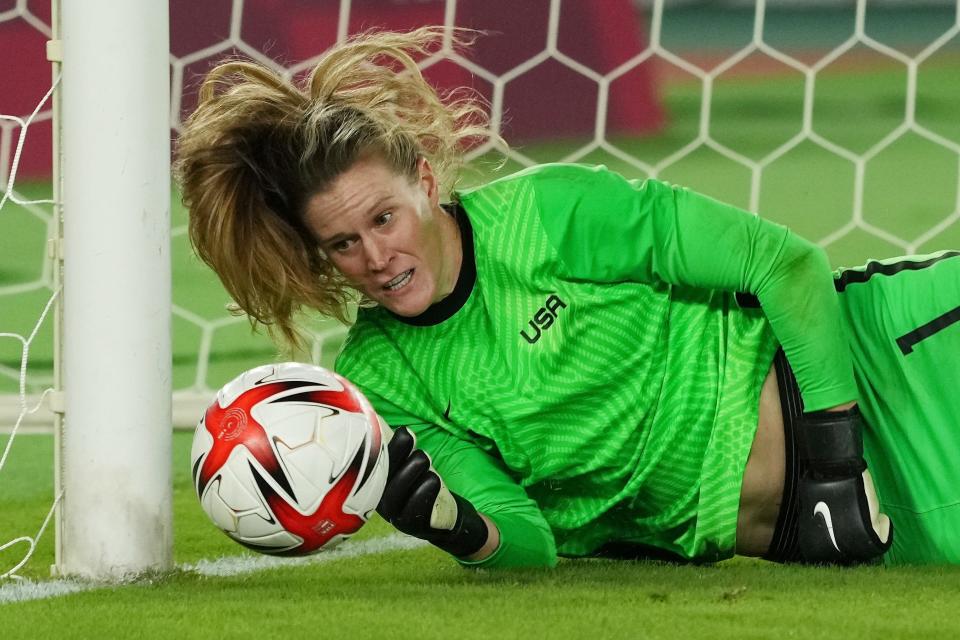 USWNT goalie Alyssa Naeher saves a shot against the Netherlands in a penalty shootout during the women's quarterfinals at the Tokyo Olympics.