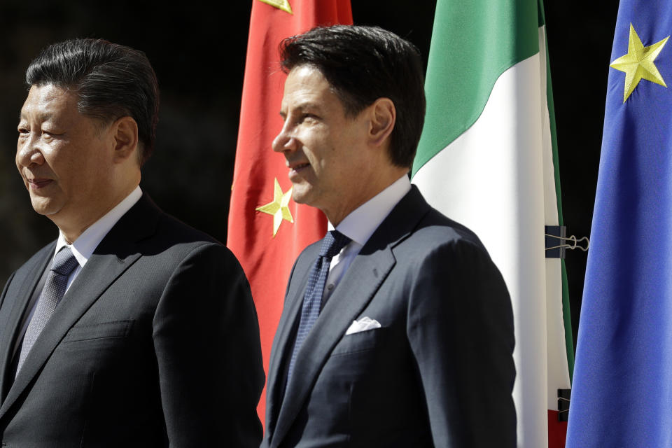 Chinese President Xi Jinping, left, and Italian Premier Giuseppe Conte pose for photographers during their meeting at Rome's Villa Madama, Saturday, March 23, 2019. (AP Photo/Andrew Medichini)