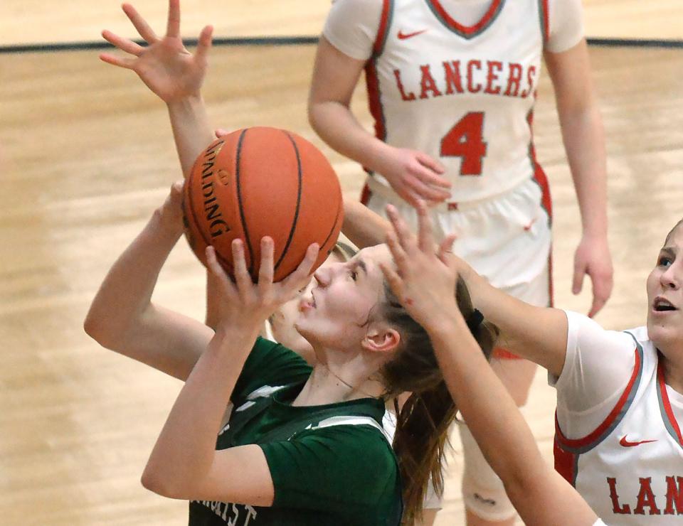Mercyhurst Prep senior Olivia Kulyk scores between three Neshannock defenders during a PIAA Class 3A second-round game at Sharon High School in Sharon on March 12.