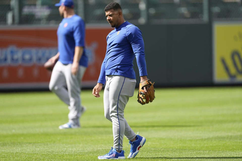 New York Mets third baseman Eduardo Escobar warms up before a baseball game against the Colorado Rockies, Friday, May 26, 2023, in Denver. (AP Photo/David Zalubowski)