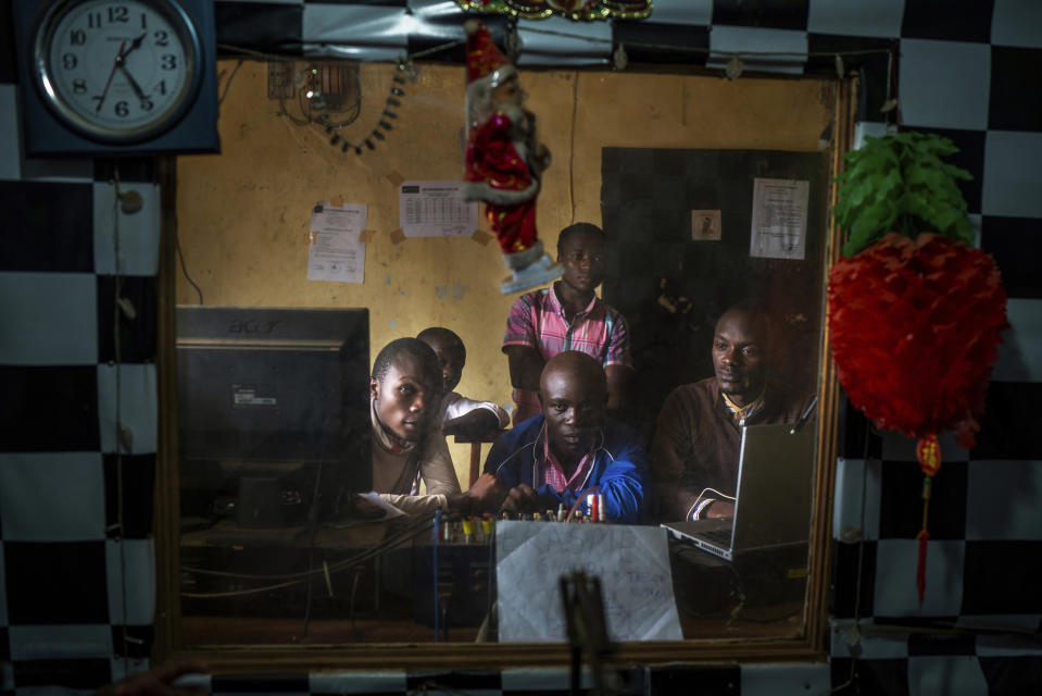 In this Saturday, July 13, 2019 photo, Congolese journalists broadcast an Ebola awareness program from a local radio station in Beni, Congo. Nearly a year of public health messages have failed to reach some Congolese who fear the Ebola vaccine is just another ploy to kill people in a region wracked by violence for a quarter century. (AP Photo/Jerome Delay)
