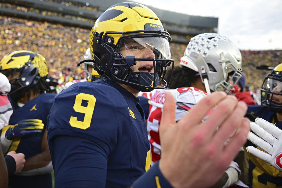 Michigan quarterback J.J. McCarthy shakes hands after Michigan defeated Ohio State 30-24 in an NCAA college football game, Saturday, Nov. 25, 2023, in Ann Arbor, Mich. (AP Photo/David Dermer)