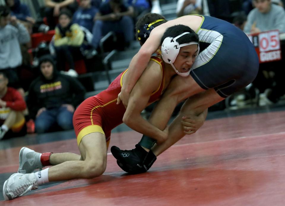 Oxnard's Cervando Tapia takes down Ryan Risdall of Dos Pueblos during their 126-pound final during the Channel League wrestling finals at Rio Mesa High on Saturday. Tapia won the title.