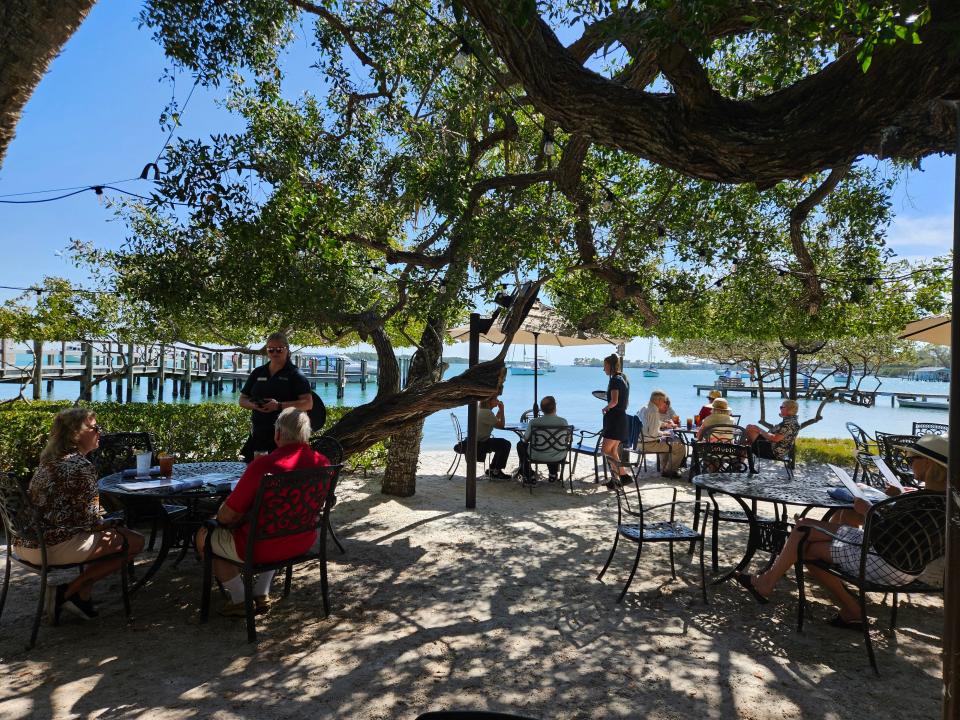 Mar Vista Dockside Restaurant, which offers seating at wrought-iron tables located under the buttonwood trees overlooking Sarasota Bay, photographed Feb. 24, 2024.