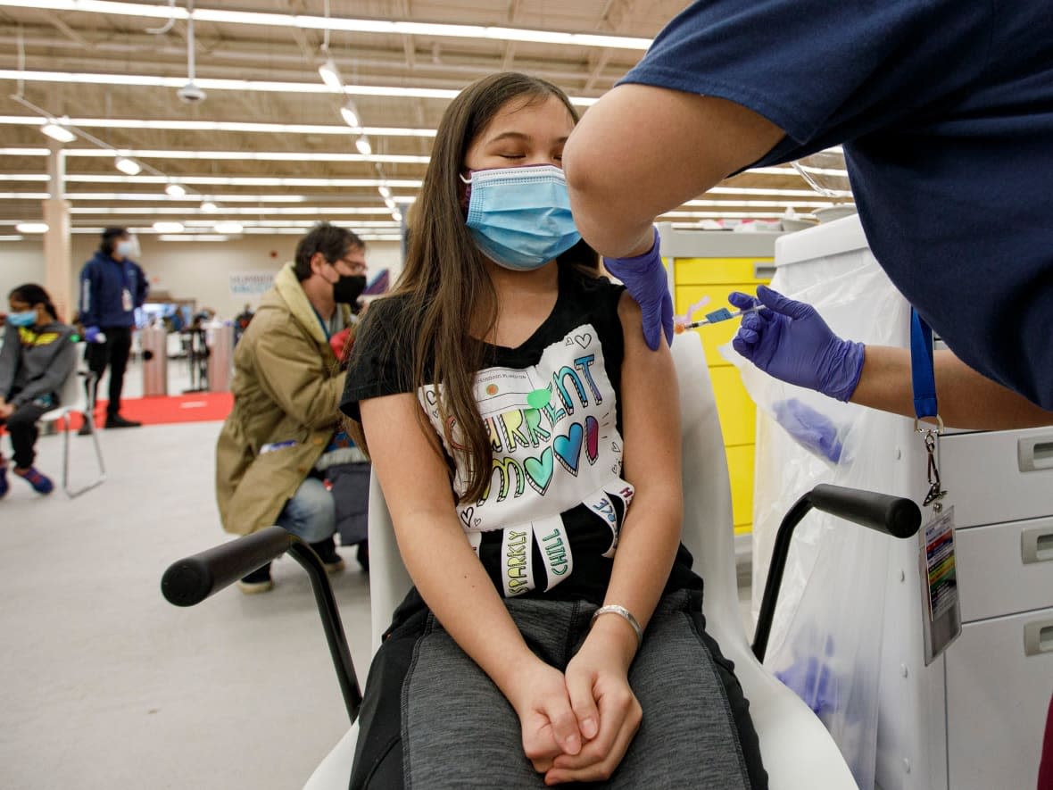 Esther Shi Berman, 10, receives a dose of COVID-19 vaccine at a Humber River Hospital-run clinic, in North York, on Nov. 25, 2021.  (Evan Mitsui/CBC - image credit)