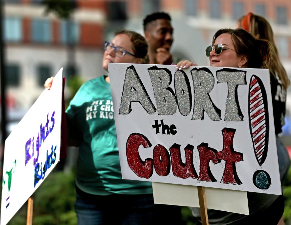 Ashley Ellis, left and her sister-in-law Kelsi Ellis, from Racine, gather with others at Red Arrow Park before starting their walk to the Milwaukee Federal Building and U.S. Courthouse during the “People’s Independence Day: Fight for our rights, repeal Wisconsin abortion ban”, on Monday, July 4, 2022.