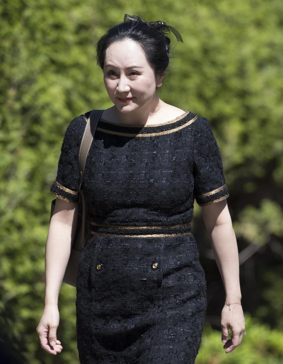 Meng Wanzhou, chief financial officer of Huawei, leaves her home to go to B.C. Supreme Court in Vancouver, British Columbia, Wednesday, May 27, 2020. (Jonathan Hayward/The Canadian Press via AP)