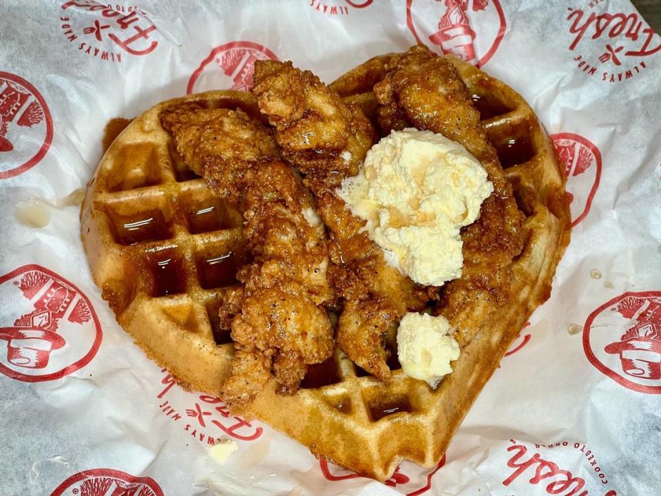 Slim Chickens offers three hand-breaded tenders on a buttermilk waffle served with butter and syrup.