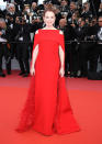 <p>Moore stunned in a Givenchy Haute Couture red cape gown. (Photo: Getty) </p>