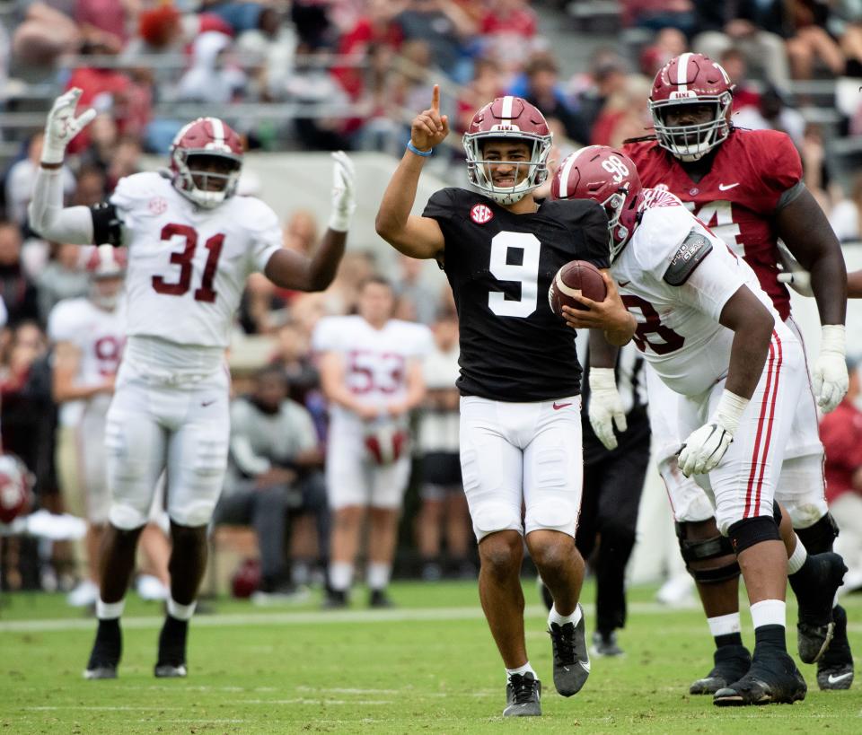 Apr 16, 2022; Tuscaloosa, Alabama, USA;  Crimson quarterback Bryce Young (9) smiles as he is tagged after scrambling away from rushers during the A-Day game at Bryant-Denny Stadium. Mandatory Credit: Gary Cosby Jr.-USA TODAY Sports