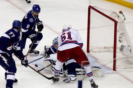 New York Rangers left wing Rick Nash (61) scores on the rebound against Tampa Bay Lightning goalie Andrei Vasilevskiy (88) with Tampa Bay Lightning defenseman Victor Hedman (77) and Tampa Bay Lightning defenseman Anton Stralman (6) providing defense in game six of the Eastern Conference Final of the 2015 Stanley Cup Playoffs at Amalie Arena. Mandatory Credit: Reinhold Matay-USA TODAY Sports