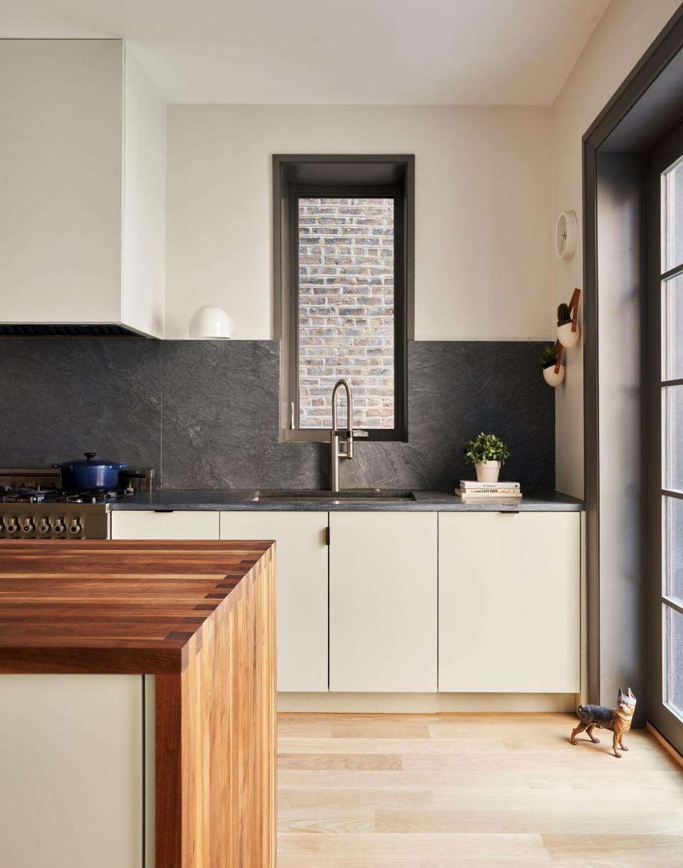 cream kitchen with dark countertop