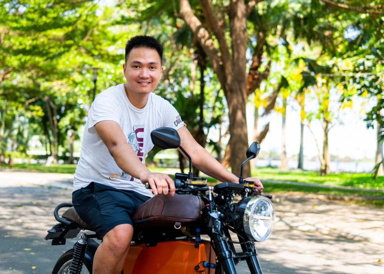 Son Nguyen, founder and chief executive officer of Dat Bike on one of the startup's motorbikes