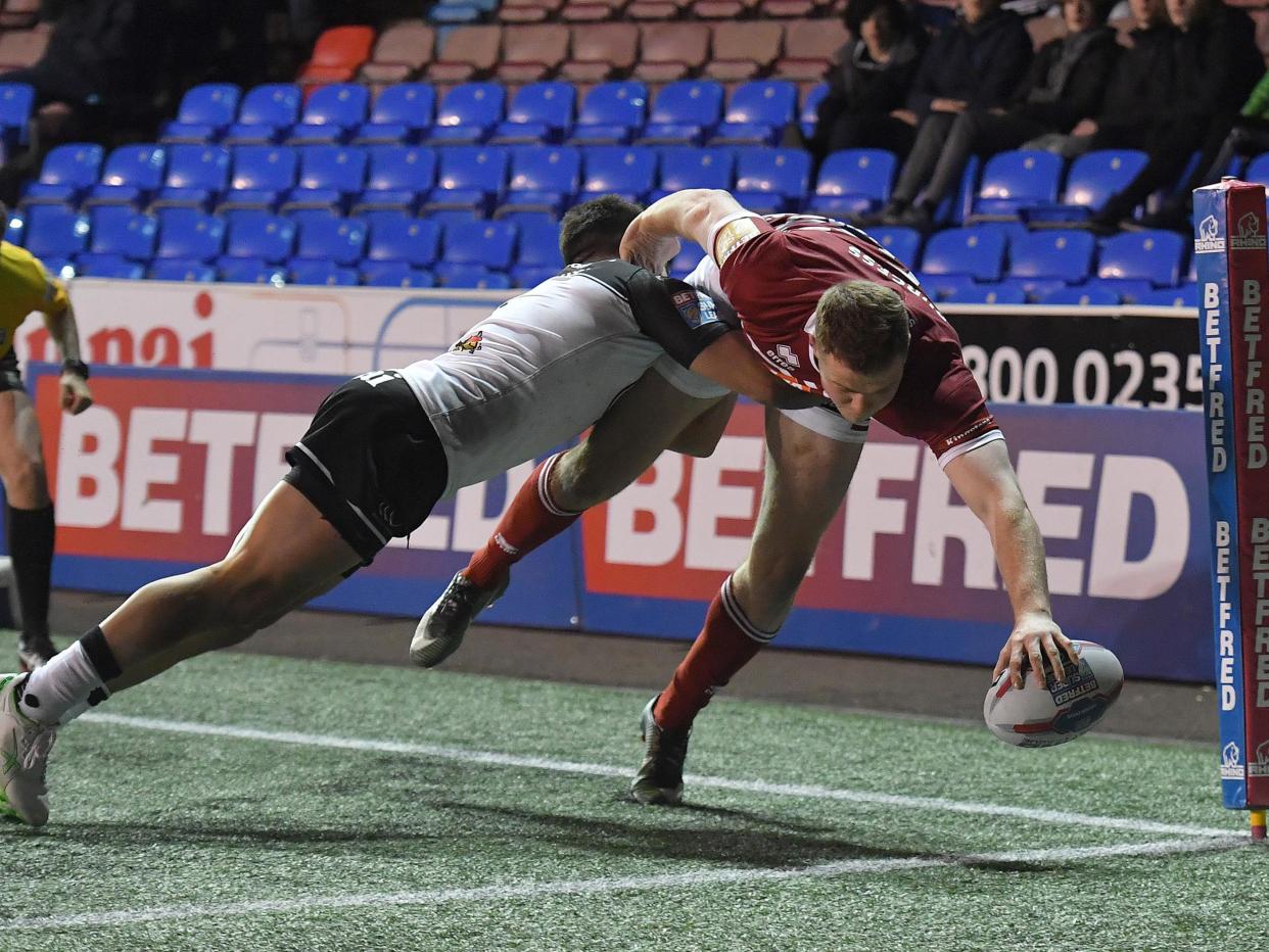 Wigan Warriors' Joe Burgess scores his sides 3rd try: Getty