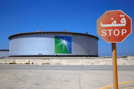 FILE PHOTO: An Aramco tank is seen at Saudi Aramco's Ras Tanura oil refinery and oil terminal in Saudi Arabia May 21, 2018. REUTERS/Ahmed Jadallah