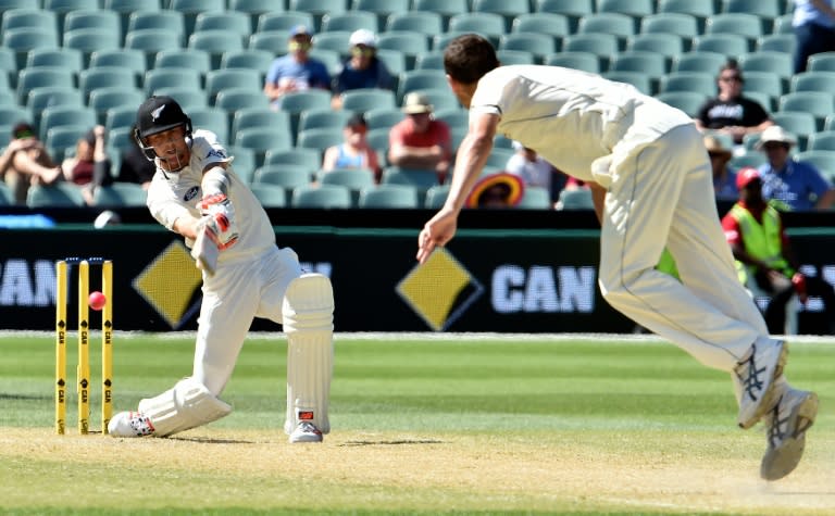 New Zealand batsman Trent Boult (L) is clean bowled off Australia paceman Jash Hazlewood during the third day of the day-night Test at the Adelaide Oval on November 29, 2015