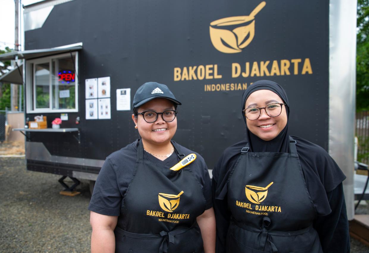 Owner Terre Astryani, left, and Mudi Mulyati at Bakoel Djakarta at the Cedar Tree Food Court in Eugene.
