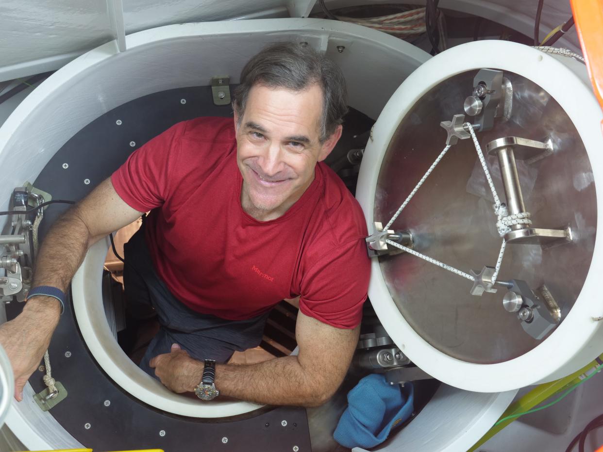 Falmouth resident Bruce Strickrott, lead pilot for Woods Hole Oceanographic Institution's Alvin, is shown in the hatch of the deep-sea submersible. A newly identified species of deep-sea worm, Pectinereis strickrotti, has been named in Strickrott’s honor.