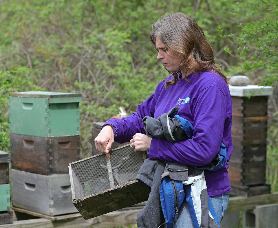 Emily Mueller shows how bees are transported at her home in New Franklin.