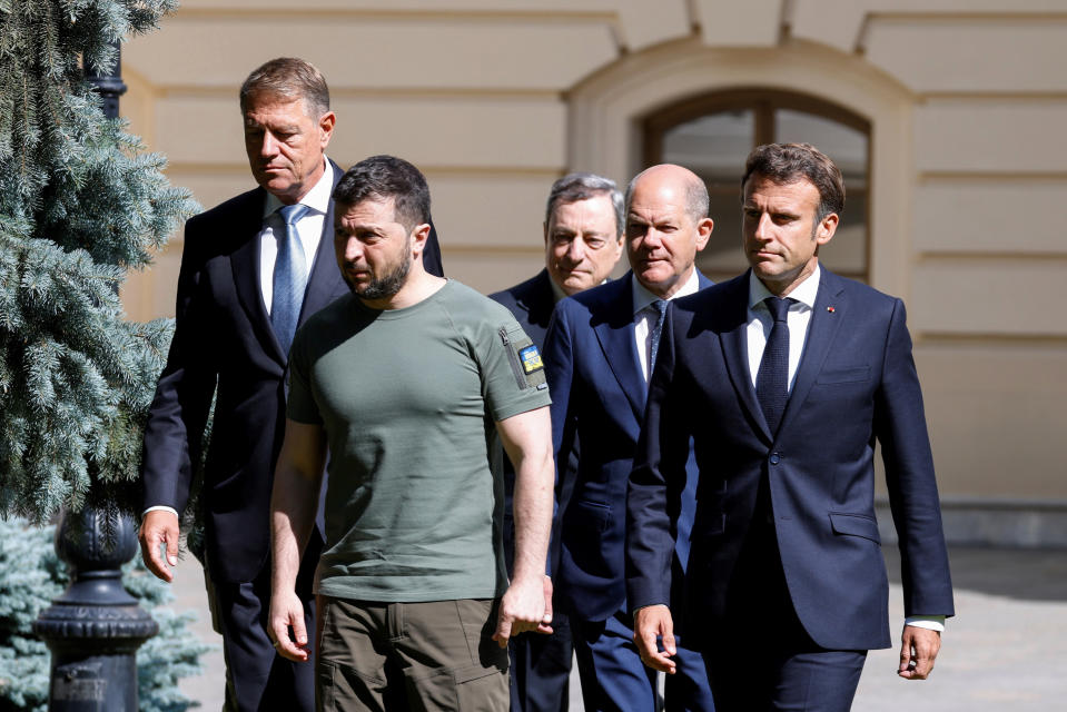 France's President Emmanuel Macron, right, Romanian President Klaus Iohannis, left, Prime Minister of Italy Mario Draghi, center, Ukraine President Volodymyr Zelenskyy, second left, and German Chancellor Olaf Scholz in Kyiv, Thursday, June 16, 2022. The leaders of four European Union nations visited Ukraine on Thursday, vowing to back Kyiv's bid to become an official candidate to join the bloc in a high-profile show of support for the country fending off a Russian invasion. (Ludovic Marin, Pool via AP)