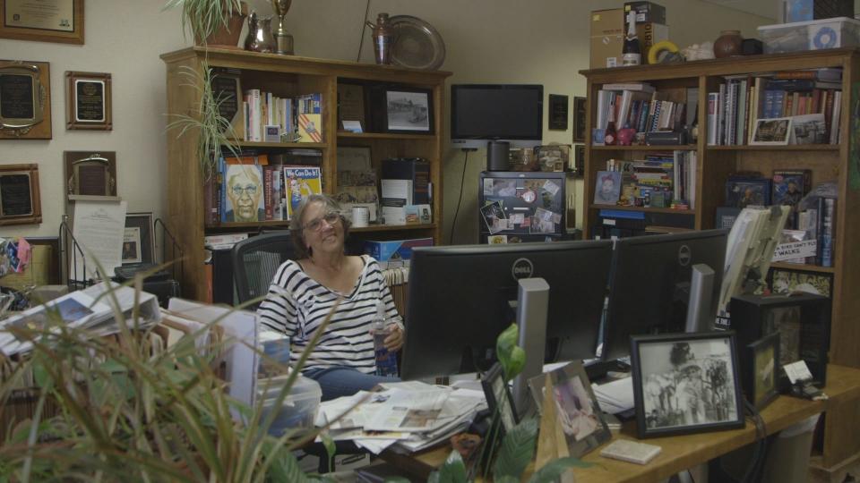 Laurie Ezzell Brown, owner, editor and all-purpose journalist, at her desk at the Canadian Record in the Texas Panhandle.
