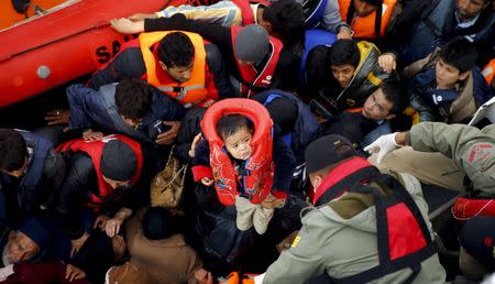 Refugees and migrants board Turkish Coast Guard Search and Rescue ship Umut-703 off the shores of Canakkale, Turkey, after a failed attempt of crossing to the Greek island of Lesbos, in this November 7, 2015 file photo. REUTERS/Umit Bektas/Files