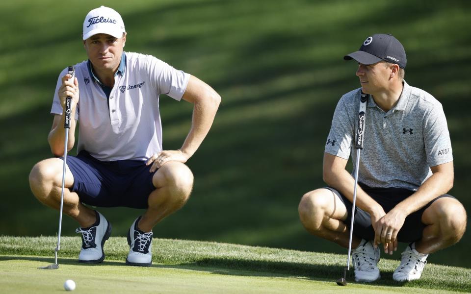 Justin Thomas of the United States and Jordan Spieth of the United States line up putts during a practice round prior to THE PLAYERS Championship on THE PLAYERS Stadium Course at TPC Sawgrass on March 07, 2023 in Ponte Vedra Beach - Getty Images/Cliff Hawkins