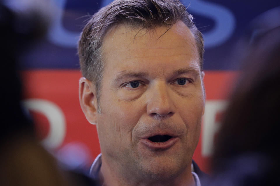 Former Kansas Secretary of State Kris Kobach talks to the media after announcing his candidacy for the Republican nomination for the U.S. Senate Monday, July 8, 2019, in Leavenworth, Kan. (AP Photo/Charlie Riedel)