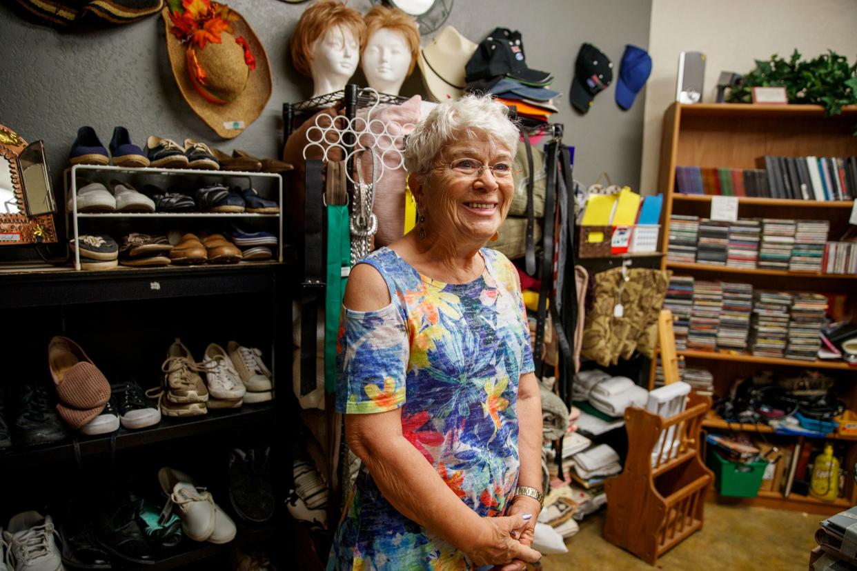 Desert Rose Thrift Shoppe volunteer Vaughn Fusco smiles as she talks about the boutique thrift store inside the Desert Hot Springs Senior Center in Desert Hot Springs, Calif., on July 14, 2021. 