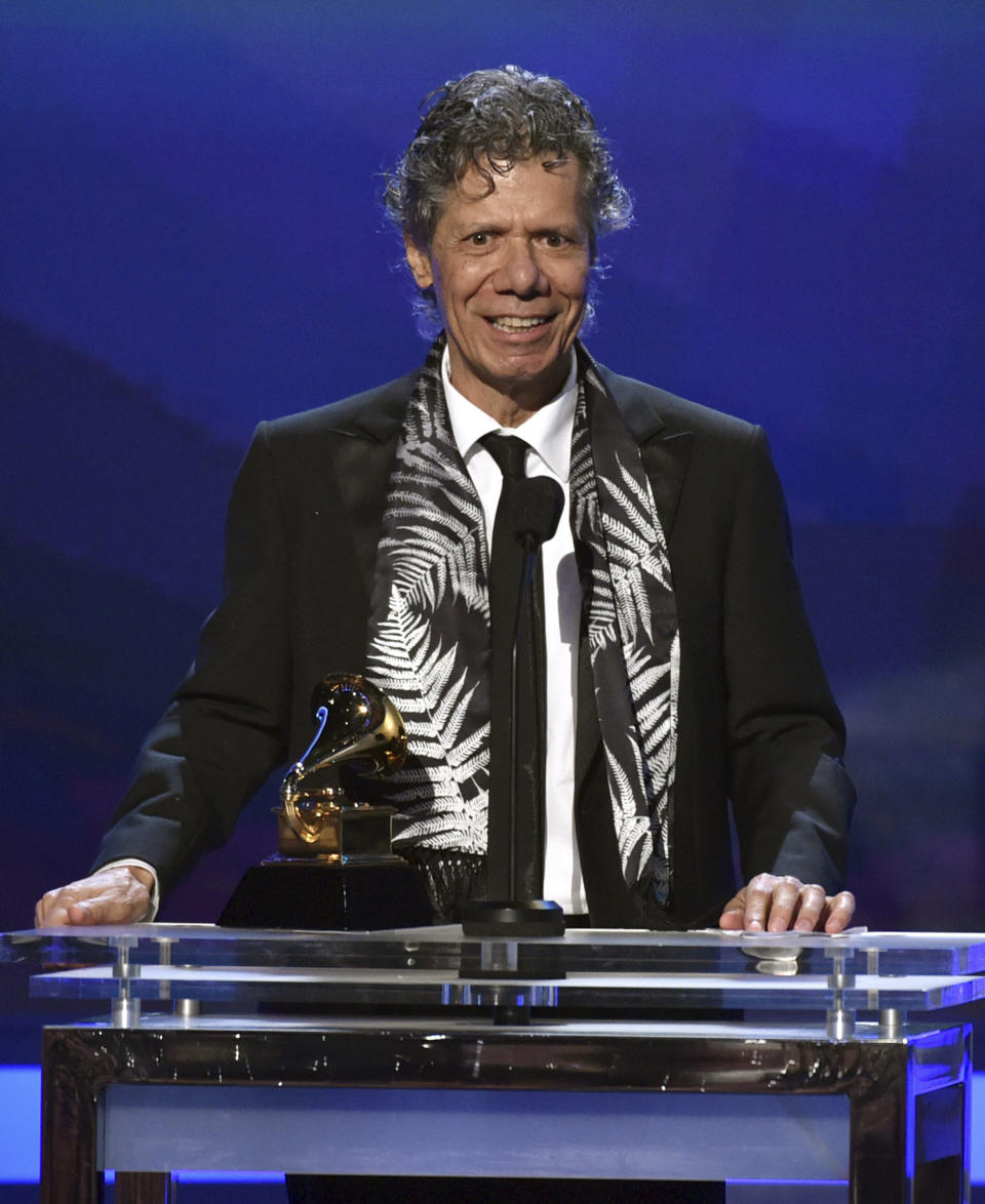 FILE - Chick Corea accepts the award for best improvised jazz solo for "Fingerprints" at the 57th annual Grammy Awards on Feb. 8, 2015, in Los Angeles. Corea, a towering jazz pianist with a staggering 23 Grammy awards who pushed the boundaries of the genre and worked alongside Miles Davis and Herbie Hancock, has died. He was 79. Corea died Tuesday, Feb. 9, 2021, of a rare for of cancer, his team posted on his web site. His death was confirmed by Corea's web and marketing manager, Dan Muse. (Photo by John Shearer/Invision/AP, File)