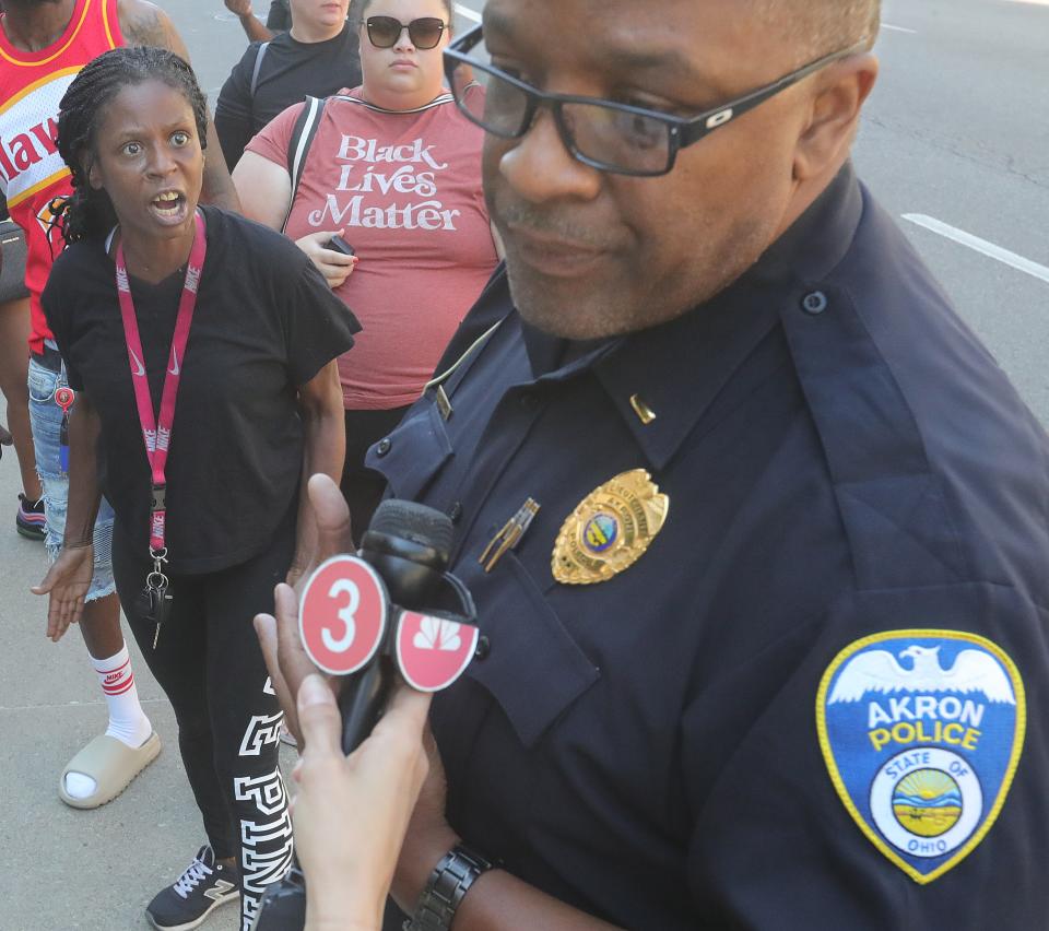 Akron Police Lt. Michael Miller, the department's public information officer,  talks with members of the media Thursday during a protest over the police-involved shooting death of Jayland Walker.