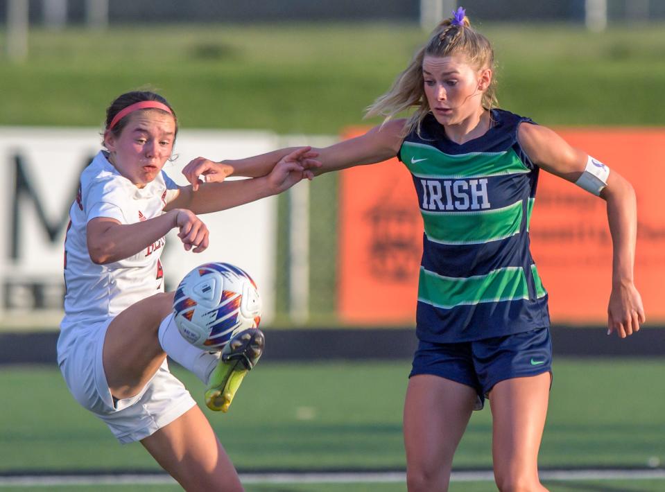 Benet Academy's Chloe Sentman, left, tries to control the ball as Peoria Notre Dame's Mya Wardle defends during their Class 2A supersectional soccer match Tuesday, May 30, 2023 in Washington. The Irish fell to the Redwings 1-0 in overtime.