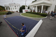 <p>Workmen prepare new carpeting for the West Wing of the White House in Washington, Friday, Aug. 11, 2017, as it undergoes renovations while President Donald Trump is spending time at his golf resort in New Jersey. (AP Photo/J. Scott Applewhite) </p>