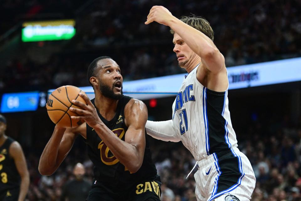 Cavaliers forward Evan Mobley works in the post against Magic center Moritz Wagner during the second half in Game 5 of a first-round NBA playoff series, April 30, 2024, in Cleveland.