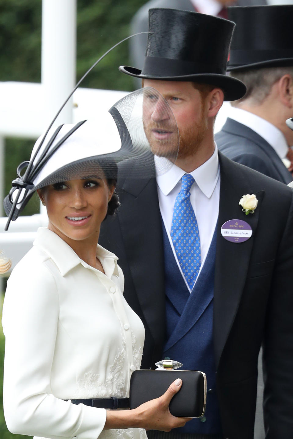 The Duchess of Sussex accessorised her racecourse aesthetic with the same Givenchy belt she donned on her debut engagement with the Queen in Cheshire. Photo: Getty