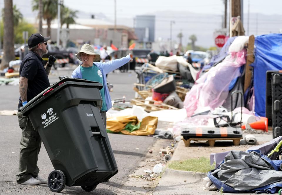 Crews begin the process of mandatory removal of "The Zone," a homeless camp in Phoenix, on May 10, 2023.