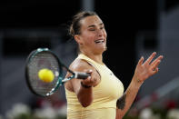 Aryna Sabalenka, of Belarus, returns the ball to Mirra Andreeva, of Russia, during the Mutua Madrid Open tennis tournament in Madrid, Wednesday, May 1, 2024. (AP Photo/Manu Fernandez)