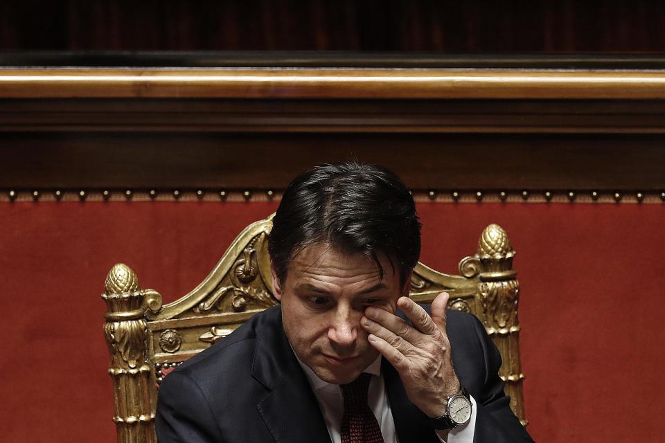 In this picture taken Saturday, Dec. 22, 2018, Italian Prime Minister Giuseppe Conte touches his eye prior to the start of a confidence vote on the budget law at the Italian Senate in Rome. (Riccardo Antimiani/ANSA Via AP)