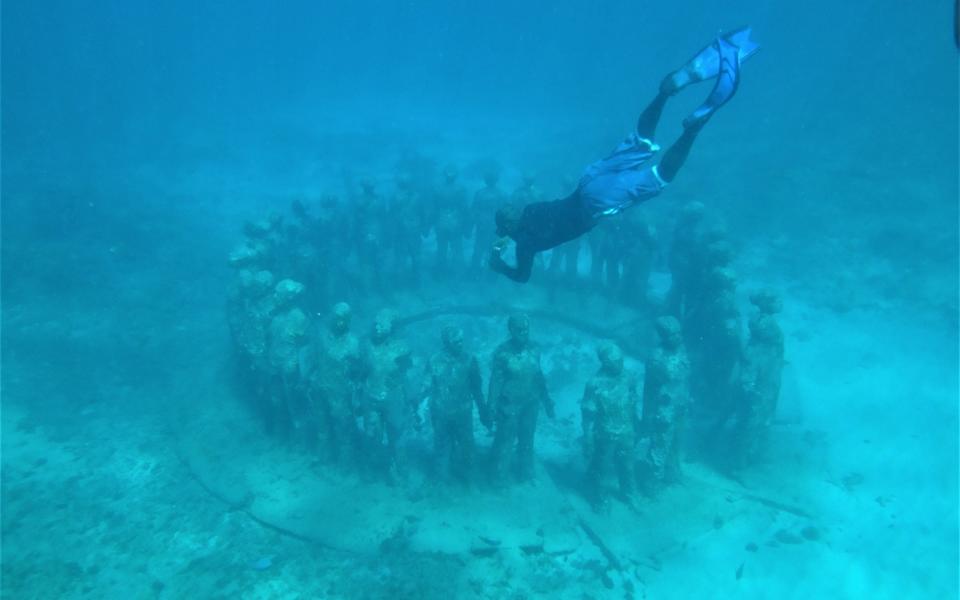 Amazing sculptures on the ocean floor at Underwater Sculpture Park in Grenada, the Caribbean - iStock