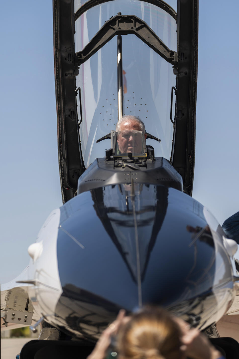 Air Force Secretary Frank Kendall sits in the front cockpit of an X-62A VISTA aircraft at Edwards Air Force Base, Calif., on Thursday, May 2, 2024. The flight on the AI-controlled aircraft is serving as a public statement of confidence in the future role of AI in air combat. The military is planning to use the technology to operate an unmanned fleet of 1,000 aircraft. Arms control experts and humanitarian groups are concerned that AI might one day be able to take lives autonomously and are seeking greater restrictions on its use. (AP Photo/Damian Dovarganes)