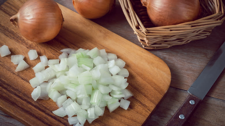 chopped onions on cutting board