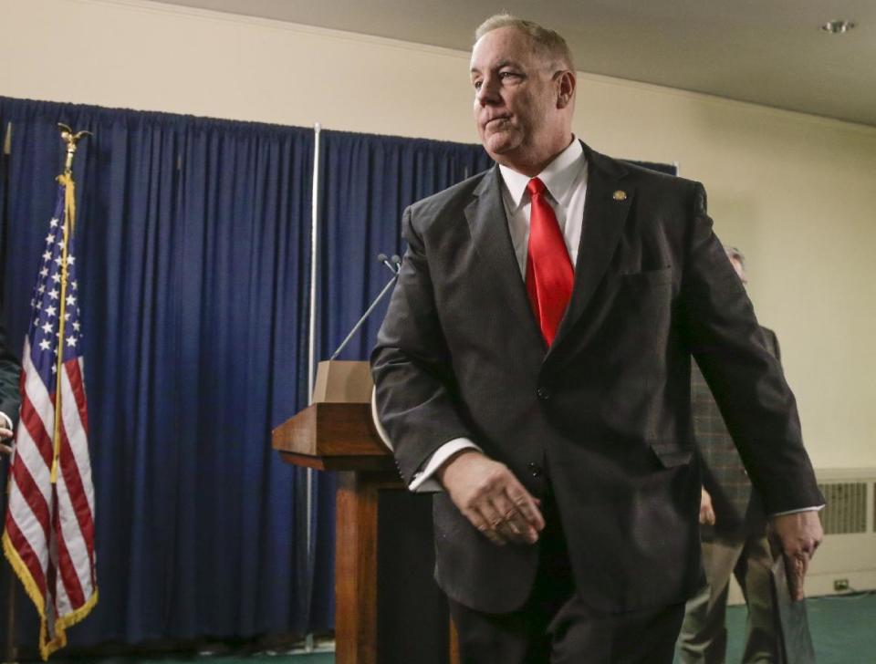 Nebraska state Sen. Bill Kintner of Papillion leaves the room after announcing at a news conference in Lincoln, Neb., Wednesday, Jan. 25, 2017, that he is resigning the seat he has held since 2012, following an uproar over a tweet he sent that implied Women's March protesters were too unattractive to be victims of sexual assault. He made the announcement less than an hour before Nebraska lawmakers were scheduled to debate whether to expel him. (AP Photo/Nati Harnik)