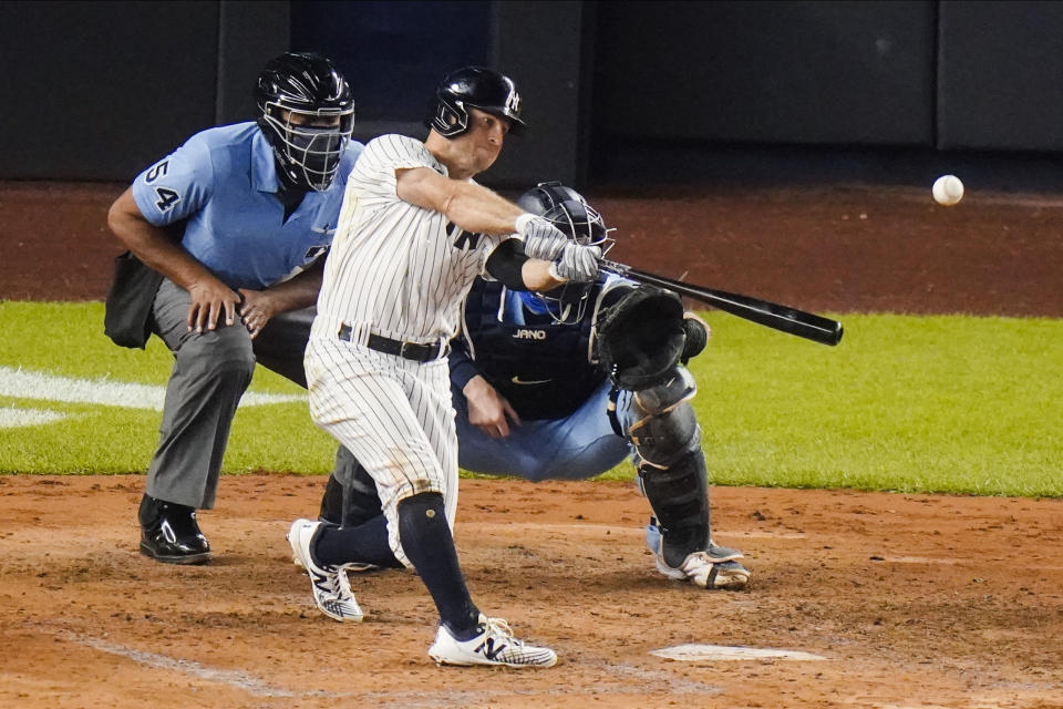 New York Yankees' Brett Gardner hits a two-run home run during the fourth inning of the team's baseball game against the Toronto Blue Jays on Thursday, Sept. 17, 2020, in New York. (AP Photo/Frank Franklin II)