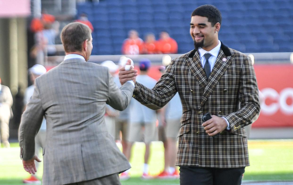 Clemson coach Dabo Swinney and quarterback D.J. Uiagalelei before the Cheez-It Bowl in Orlando.