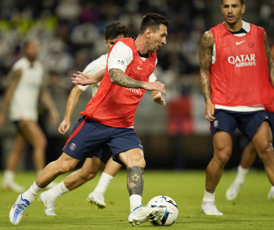 PSG's Lionel Messi participates in a drill during a training session in Suita, western Japan, Sunday, July 24, 2022. PSG faces Japan's Gamba Osaka in a friendly match Monday. (AP Photo/Hiro Komae)