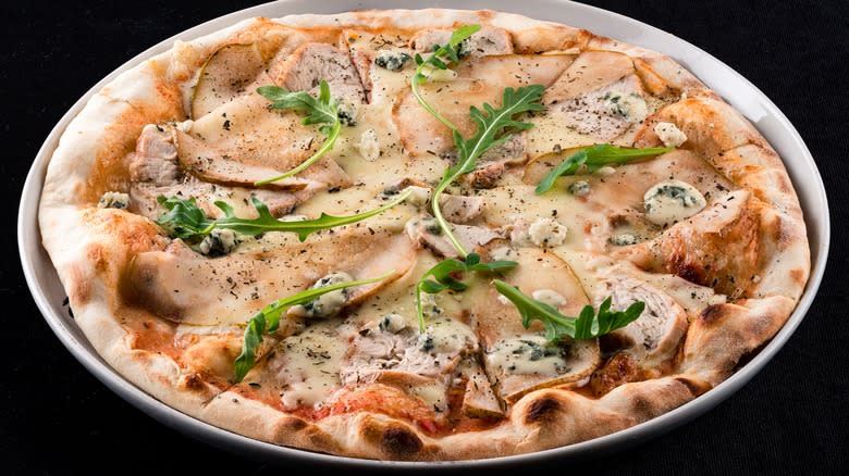 Pears on pizza with arugula
