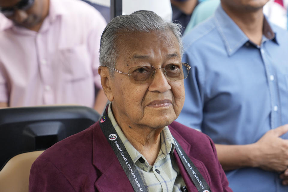 Malaysia's former Prime Minister Mahathir Mohamad, chairman of Gerakan Tanah Air (Homeland Movement) party, waits with his supporters before walking toward the nomination center in Langkawi Island, Malaysia, Saturday, Nov. 5, 2022. Campaigning for Malaysia’s general elections formally started Saturday, in a highly competitive race that will see the world’s longest-serving coalition seeking to regain its dominance four years after a shocking electoral loss. (AP Photo/Vincent Thian)