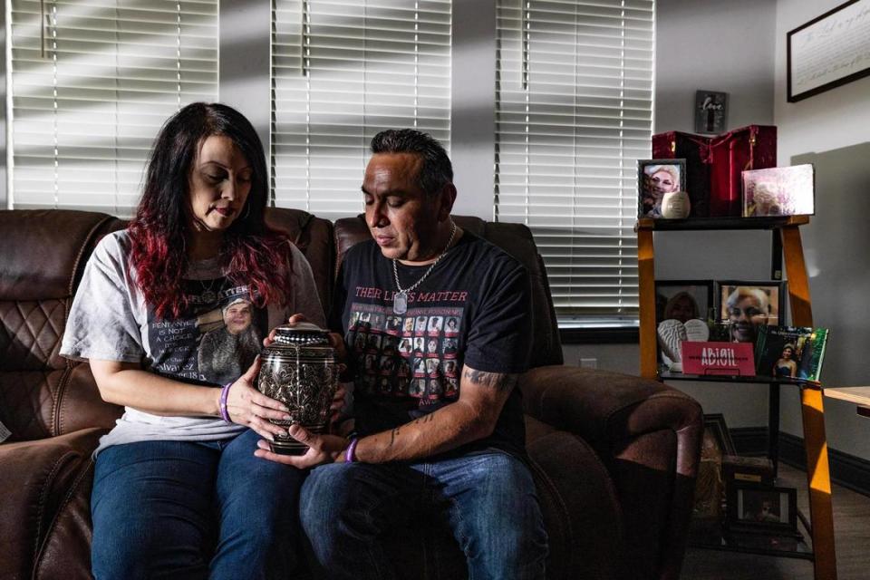 Adolph and Peggy Alvarez hold the urn of their daughter Abigail, who died from a fentanyl overdose on May 14, 2022 at 18 years of age, at their apartment in Fort Worth on Thursday, Aug. 17, 2023. Fentanyl-related deaths have surged in North Texas over since 2020. Chris Torres/ctorres@star-telegram.com