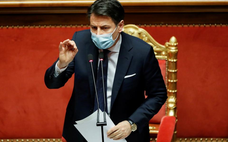 Italian Prime Minister Giuseppe Conte gestures as he speaks ahead of a confidence vote at the upper house of parliament - Yara Nardi/Reuters